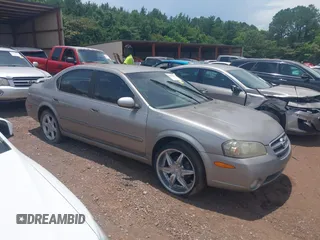 2002 Nissan Maxima GXE z VIN JN1DA31D02T202083, wystawiony jako IAAI lot #42496695 z przebiegiem 156 491 mil mil oraz . Historia ofert i sprzedaży dostępna na DreamBid. Obrazek 1.