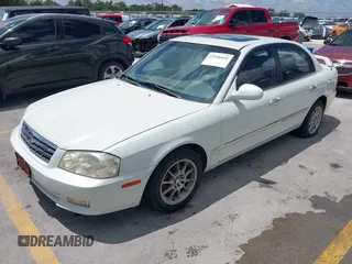 2002 Kia Optima LX z VIN KNAGD126325144218, wystawiony jako IAAI lot #42596691 z przebiegiem 220 972 mil mil oraz . Historia ofert i sprzedaży dostępna na DreamBid. Obrazek 2.