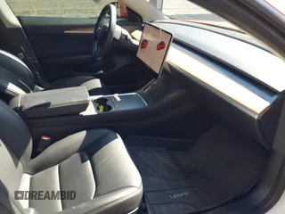 2022 Tesla Model 3 with VIN 5YJ3E1EA5NF168201, listed as a IAAI auction lot 41855273 with 31,393 mi miles and . Bid and sale history available at DreamBid. Image 5.