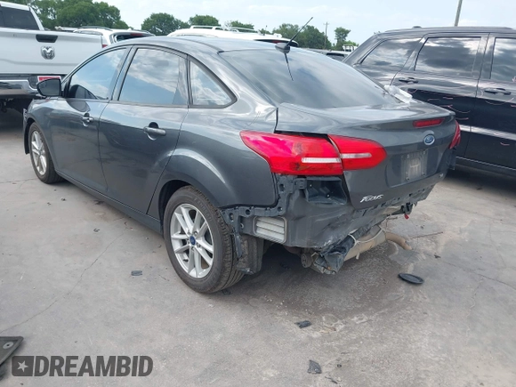 2018 Ford Focus SE with VIN 1FADP3F22JL295342, listed as a IAAI auction lot 42335881 with 77,464 mi miles and . Bid and sale history available at DreamBid. Image 3.