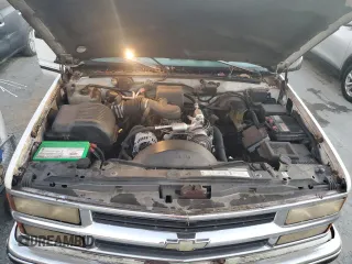 1996 Chevrolet Suburban z VIN 3GNFK16R7TG124404, wystawiony jako Copart lot #77361264 z przebiegiem 256 935 mil mil oraz Szkoda całkowita • Salvage title. Historia ofert i sprzedaży dostępna na DreamBid. Obrazek 12.