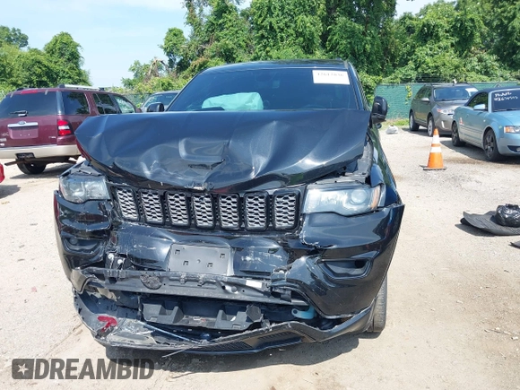 2018 Jeep Grand Cherokee Upland with VIN 1C4RJFAG2JC350975, listed as a IAAI auction lot 42612836 with 148,435 mi miles and . Bid and sale history available at DreamBid. Image 12.