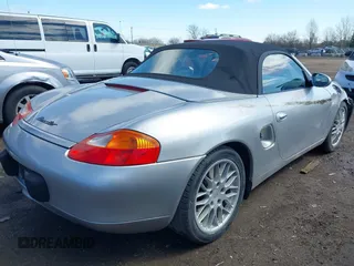 1999 Porsche Boxster z VIN WP0CA2989XU627152, wystawiony jako IAAI lot #41805432 z przebiegiem 112 380 mil mil oraz . Historia ofert i sprzedaży dostępna na DreamBid. Obrazek 4.