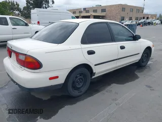 1997 Mazda Protege DX with VIN JM1BC1417V0156858, listed as a IAAI auction lot 42118339 with 187,673 mi miles and . Bid and sale history available at DreamBid. Image 4.