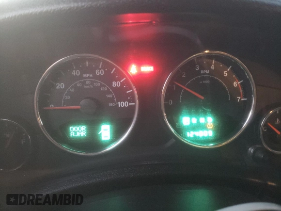 2011 Jeep Wrangler Sahara with VIN 1J4GA5D11BL627667, listed as a Copart auction lot 87227054 with 124,009 mi miles and Clean Title. Bid and sale history available at DreamBid. Image 9.