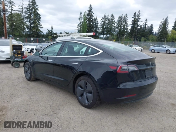 2019 Tesla Model 3 Mid Range with VIN 5YJ3E1EA6KF415656, listed as a IAAI auction lot 42140763 with 71,408 mi miles and . Bid and sale history available at carsss.com. Image 3.