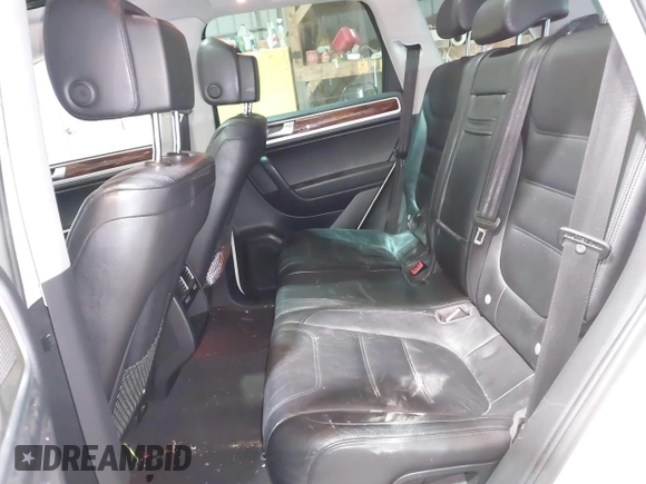 2011 Volkswagen Touareg Sport with VIN WVGFF9BP8BD004747, listed as a IAAI auction lot 41780515 with 159,228 mi miles and . Bid and sale history available at DreamBid. Image 8.
