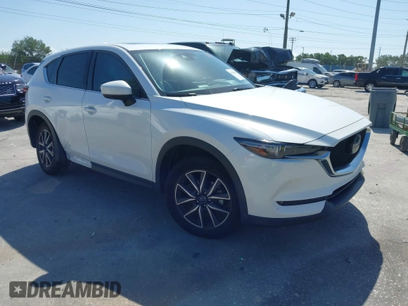 2018 Mazda CX-5 Grand Touring with VIN JM3KFADM2J1422512, listed as a IAAI auction lot 42010801 with 48,567 mi miles and . Bid and sale history available at DreamBid. Image 1.