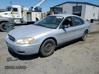 2005 Ford Taurus SE with VIN 1FAFP53U25A303516, listed as a Copart auction lot 63250505 with 203,463 mi miles and Salvage title. Bid and sale history available at DreamBid. Image 1.