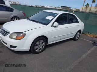 2009 Kia Spectra EX with VIN KNAFE221795630995, listed as a IAAI auction lot 41928252 with 126,694 mi miles. Bid and sale history available at carsss.com. Image 2.