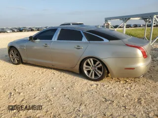 2014 Jaguar XJ Portfolio with VIN SAJWJ2GD7E8V61558, listed as a Copart auction lot 66850034 with 130,984 mi miles and Salvage title. Bid and sale history available at DreamBid. Image 2.