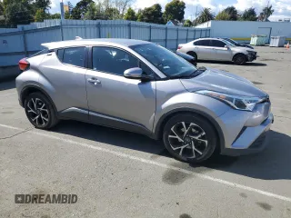 2018 Toyota C-HR XLE with VIN NMTKHMBX6JR047937, listed as a Copart auction lot 51705805 with 128,543 mi miles and Salvage Title. Bid and sale history available at DreamBid. Image 4.