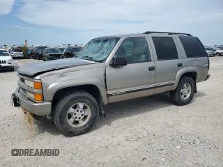 2000 Chevrolet Tahoe Z71 with VIN 1GNEK13RXYR137011, listed as a Copart auction lot 63754865 with 151,766 mi miles and Salvage title. Bid and sale history available at DreamBid. Image 1.