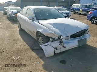 2007 Jaguar X-Type z VIN SAJWA51A07WJ14424, wystawiony jako Copart lot #84556864 z przebiegiem Nie podano mil oraz Szkody całkowita. Historia ofert i sprzedaży dostępna na DreamBid. Obrazek 11.