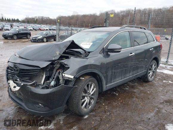 2015 Mazda CX-9 Grand Touring with VIN JM3TB2DAXF0447537, listed as a IAAI auction lot 41191694 with 157,113 mi miles. Bid and sale history available at carsss.com. Image 17.