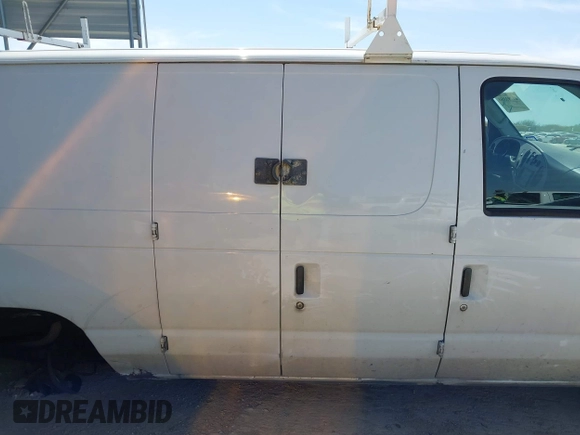 2004 Ford Econoline Cargo with VIN 1FTRE14W44HA29084, listed as a IAAI auction lot 41793350 with 123,429 mi miles. Bid and sale history available at carsss.com. Image 13.