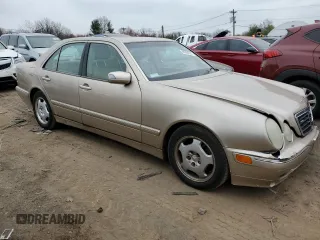 2002 Mercedes-Benz E-Class with VIN WDBJF82J52X062915, listed as a Copart auction lot 48284604 with 150,227 mi miles and Salvage Title. Bid and sale history available at carsss.com. Image 4.