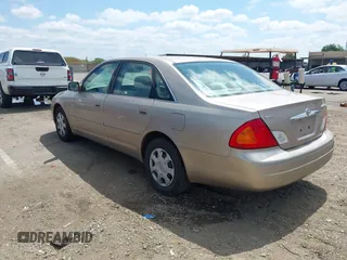 2001 Toyota Avalon XL w/Bucket Seats with VIN 4T1BF28B61U185881, listed as a IAAI auction lot 42138345 with 242,195 mi miles. Bid and sale history available at carsss.com. Image 3.