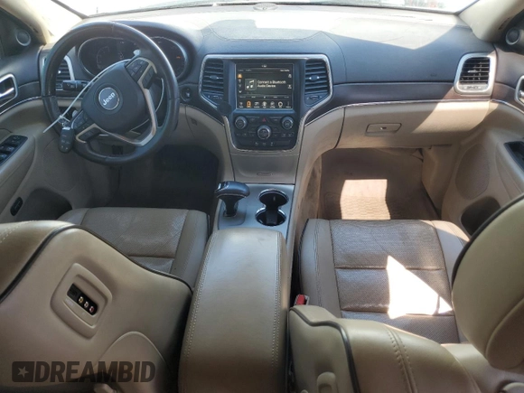 2015 Jeep Grand Cherokee Overland with VIN 1C4RJFCM4FC618516, listed as a Copart auction lot 58671455 with 221,550 mi miles and Clean title. Bid and sale history available at DreamBid. Image 8.