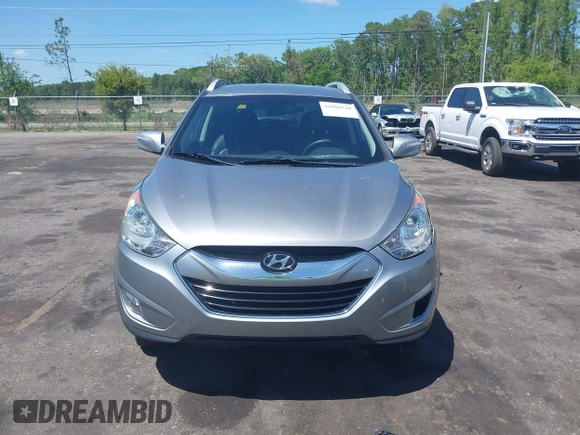 2013 Hyundai Tucson GLS with VIN KM8JU3AC4DU588062, listed as a IAAI auction lot 42080348 with 76,937 mi miles. Bid and sale history available at carsss.com. Image 12.