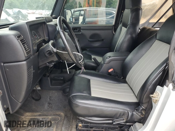 2005 Jeep Wrangler X with VIN 1J4FA39S55P353789, listed as a Copart auction lot 62469015 with 143,817 mi miles and Salvage title. Bid and sale history available at DreamBid. Image 7.