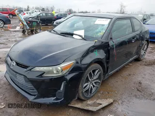 2014 Scion tC with VIN JTKJF5C74E3069104, listed as a IAAI auction lot 41579797 with 130,668 mi miles. Bid and sale history available at carsss.com. Image 17.