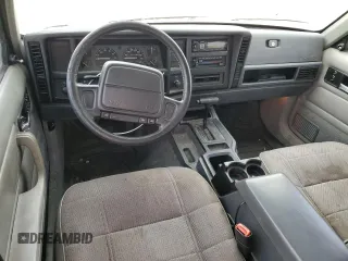 1996 Jeep Cherokee Sport with VIN 1J4FT68S4TL333342, listed as a Copart auction lot 41664965 with 185,199 mi miles and Clean Title. Bid and sale history available at carsss.com. Image 8.