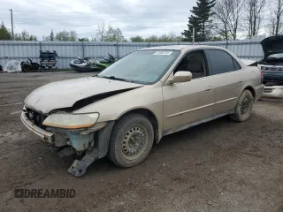 2001 Honda Accord LX z VIN 1HGCG56471A806768, wystawiony jako Copart lot #57066765 z przebiegiem 166 743 mil mil oraz Czysty tytuł • Clean title. Historia ofert i sprzedaży dostępna na DreamBid. Obrazek 1.