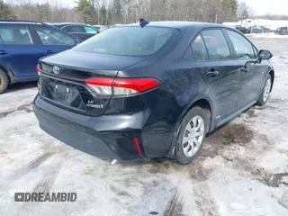2023 Toyota Corolla Hybrid LE with VIN JTDBDMHE7P3004396, listed as a IAAI auction lot 41606222 with 15,037 mi miles. Bid and sale history available at carsss.com. Image 4.