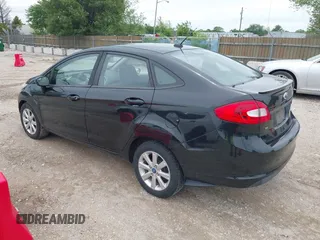 2011 Ford Fiesta SE z VIN 3FADP4BJ3BM147784, wystawiony jako IAAI lot #42567083 z przebiegiem 104 843 mil mil oraz . Historia ofert i sprzedaży dostępna na DreamBid. Obrazek 3.