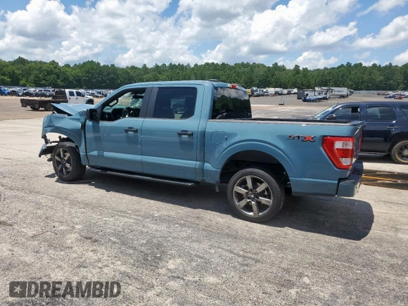 2023 Ford F-150 XL with VIN 1FTEW1CP7PKD02399, listed as a Copart auction lot 60738155 with 23,059 mi miles and Salvage title. Bid and sale history available at DreamBid. Image 2.