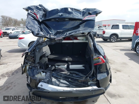 2022 Tesla Model Y Long Range z VIN 7SAYGAEE5NF428327, wystawiony jako IAAI lot #41698750 z przebiegiem 26 846 mil mil oraz . Historia ofert i sprzedaży dostępna na DreamBid. Obrazek 6.