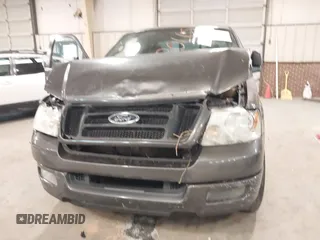 2005 Ford F-150 STX with VIN 1FTRX12W95NB38107, listed as a IAAI auction lot 41185100 with 201,171 mi miles. Bid and sale history available at carsss.com. Image 6.