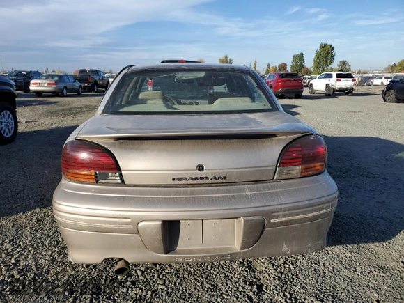 1996 Pontiac Grand Am SE2 with VIN 1G2NE52T3TC834038, listed as a Copart auction lot 76610794 with 140,379 mi miles and Salvage Title. Bid and sale history available at carsss.com. Image 6.