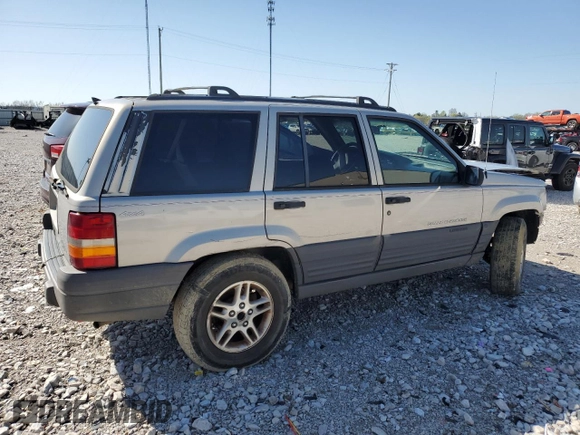 1997 Jeep Grand Cherokee Laredo with VIN 1J4GZ58S5VC561060, listed as a Copart auction lot 52098315 with 267,245 mi miles and Salvage title. Bid and sale history available at DreamBid. Image 3.
