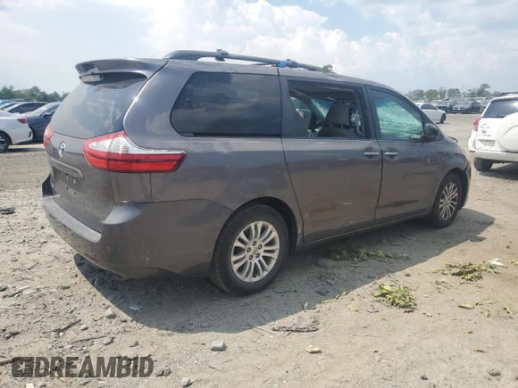 2015 Toyota Sienna XLE with VIN 5TDYK3DC6FS576670, listed as a Copart auction lot 62612345 with 106,475 mi miles and Salvage title. Bid and sale history available at DreamBid. Image 3.