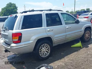 2004 Jeep Grand Cherokee Limited with VIN 1J4GW58N64C283657, listed as a IAAI auction lot 42542150 with 228,910 mi miles and . Bid and sale history available at DreamBid. Image 4.