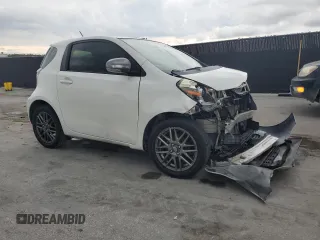 2013 Scion iQ with VIN JTNJJXB01DJ022687, listed as a Copart auction lot 61918195 with 117,483 mi miles and Salvage title. Bid and sale history available at DreamBid. Image 4.