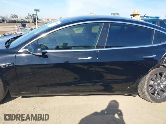 2018 Tesla Model 3 Long Range Battery with VIN 5YJ3E1EA0JF056979, listed as a IAAI auction lot 41865849 with 97,319 mi miles. Bid and sale history available at carsss.com. Image 14.