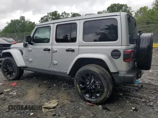 2024 Jeep Wrangler Sahara with VIN 1C4RJXP65RW210689, listed as a Copart auction lot 66482724 with 4,872 mi miles and Salvage Title. Bid and sale history available at DreamBid. Image 2.