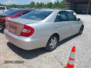 2002 Toyota Camry XLE z VIN 4T1BF32K42U531992, wystawiony jako IAAI lot #42294926 z przebiegiem 294 929 mil mil oraz . Historia ofert i sprzedaży dostępna na DreamBid. Obrazek 4.
