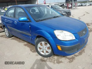 2008 Kia Rio LX with VIN KNADE123486430555, listed as a IAAI auction lot 41875641 with 121,280 mi miles. Bid and sale history available at carsss.com. Image 1.