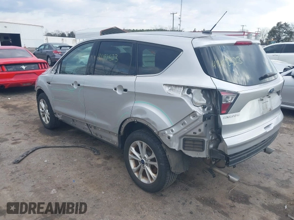 2017 Ford Escape SE z VIN 1FMCU9GDXHUA46689, wystawiony jako IAAI lot #41492523 z przebiegiem 67 401 mil mil oraz . Historia ofert i sprzedaży dostępna na DreamBid. Obrazek 3.