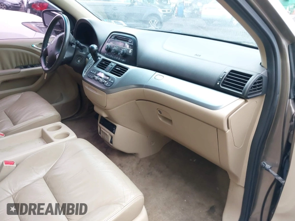 2009 Honda Odyssey EX-L with VIN 5FNRL38759B022866, listed as a IAAI auction lot 42200965 with 145,641 mi miles and . Bid and sale history available at DreamBid. Image 5.