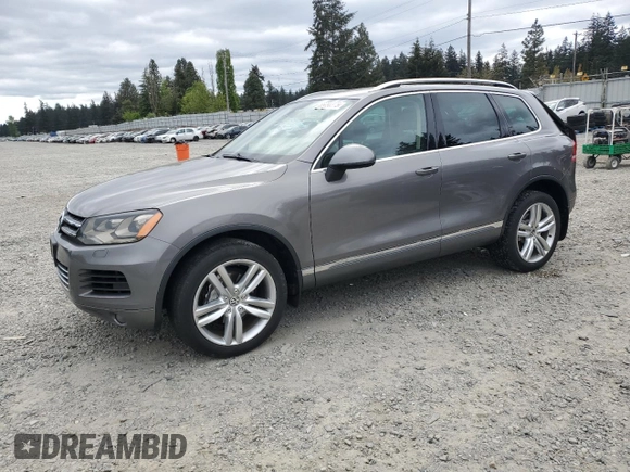 2012 Volkswagen Touareg Sport with VIN WVGFK9BP4CD001860, listed as a Copart auction lot 55090375 with 153,456 mi miles and Salvage title. Bid and sale history available at DreamBid. Image 1.