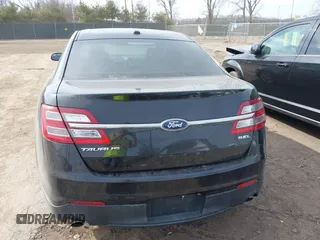 2013 Ford Taurus SEL with VIN 1FAHP2E84DG188503, listed as a IAAI auction lot 41800277 with 215,015 mi miles. Bid and sale history available at carsss.com. Image 16.
