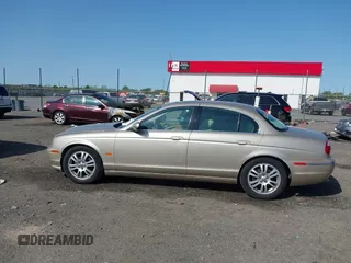 2005 Jaguar S-Type with VIN SAJWA01T95FN22745, listed as a IAAI auction lot 41898269 with 57,614 mi miles and . Bid and sale history available at DreamBid. Image 14.