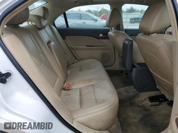 2012 Ford Fusion SEL z VIN 3FAHP0JA3CR184074, wystawiony jako Copart lot #51973675 z przebiegiem 192 732 mil mil oraz Szkoda całkowita • Salvage title. Historia ofert i sprzedaży dostępna na DreamBid. Obrazek 10.