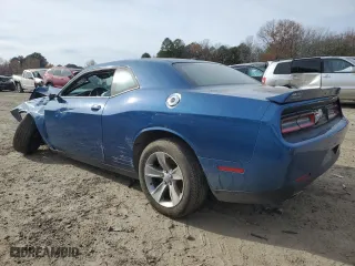 2021 Dodge Challenger SXT with VIN 2C3CDZAG3MH534312, listed as a Copart auction lot 79314043 with 90,834 mi miles and Salvage Title. Bid and sale history available at carsss.com. Image 2.