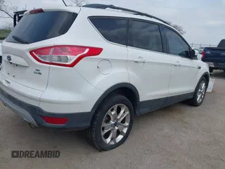2014 Ford Escape SE with VIN 1FMCU9GX9EUB15944, listed as a IAAI auction lot 42110269 with 120,297 mi miles and . Bid and sale history available at DreamBid. Image 4.